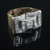 A 1940's/50's gold, platinum and diamond cluster cocktail ring, of pierced buckle design, size M.
