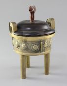 A Chinese bronze tripod censer, 19th century, the drum shaped body cast in relief with flowerheads