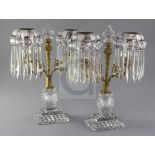 A pair of Regency ormolu mounted cut glass candelabra, with spear shaped drops, height 12.5in.