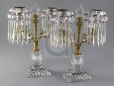 A pair of Regency ormolu mounted cut glass candelabra, with spear shaped drops, height 12.5in.