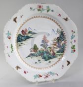 A Chinese famille rose octagonal dish, Qianlong period, painted with pavilions in a mountainous