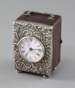 A late Victorian repousse silver mounted carriage timepiece, retailed by Harris, Bath, with French