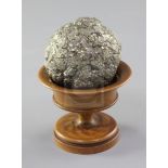 A Teklite nodule, diameter 2.5in., with wooden stand