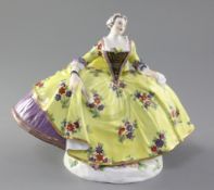 A Meissen figure of a noble lady, after J.J. Kandler, 19th century, wearing a large yellow ground