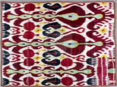 An 1880-1900 Uzbekistan hand-woven and dyed Ikat, designed in white, red, green, purple, yellow