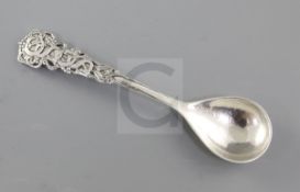 A George V Arts & Crafts cast planished silver spoon, by Omar Ramsden, hallmarked London 1932, the