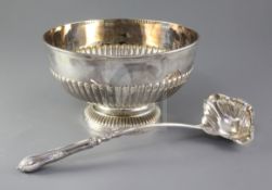 An Edwardian demi fluted silver punch bowl by Mappin & Webb, on pedestal foot, Sheffield, 1909,