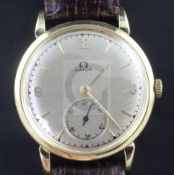 A gentleman's 1940's 18ct gold Omega manual wind "bumper" movement wrist watch, with baton and