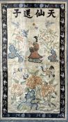 A Chinese embroidered silk panel, 19th century, woven with a four character inscription, the