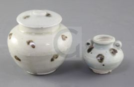 A Chinese Qiangbai iron spot covered jarlet and a smaller two handled jarlet, Yuan dynasty, 14th