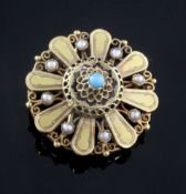 A gold, seed pearl and turquoise set circular pendant brooch, 34mm.