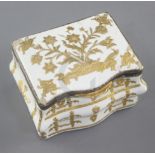 A late 18th / early 19th century French gilt metal mounted commode shaped white enamel snuff box,