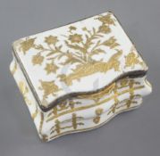 A late 18th / early 19th century French gilt metal mounted commode shaped white enamel snuff box,