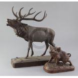 A Black Forest carved wood model of a ten point stag, height 14.5in. and a model of a wild boar,