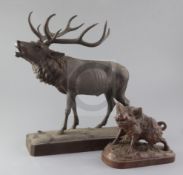 A Black Forest carved wood model of a ten point stag, height 14.5in. and a model of a wild boar,