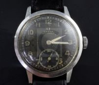 A gentleman's 1940's/1950's stainless steel Omega (non magnetic) manual wind wrist watch, with black