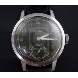 A gentleman's 1940's/1950's stainless steel Omega (non magnetic) manual wind wrist watch, with black