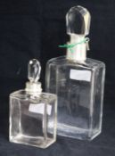 A silver mounted glass locking decanter by Hukin & Heath, Birmingham, 1933 and a smaller silver