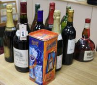 Ten bottles of mixed French wines, one of Cointreau (boxed) and one of Remy Martin (12)