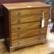 An Edwardian mahogany miniature chest, fitted five long drawers, on bracket feet, W 38cm