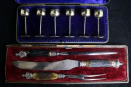 A set of six miniature silver-stemmed goblets and a three-piece carving set (both cased).