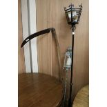 A scythe and two metal lamps