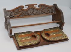 A victorian brass mounted rosewood book slide and a carved oak book rack