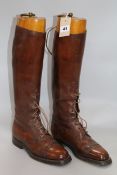 A pair of gentleman's tan leather riding boots, with stretchers