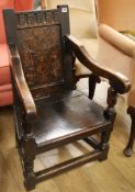 An oak panel-back chair, 17th century and later, of small proportions, having carved and inlaid