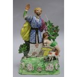 A late 18th century staffordshire group of Abraham and Elijah height 28cm