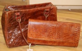 A 1930's crocodile handbag plus a simulated crocodile clutch