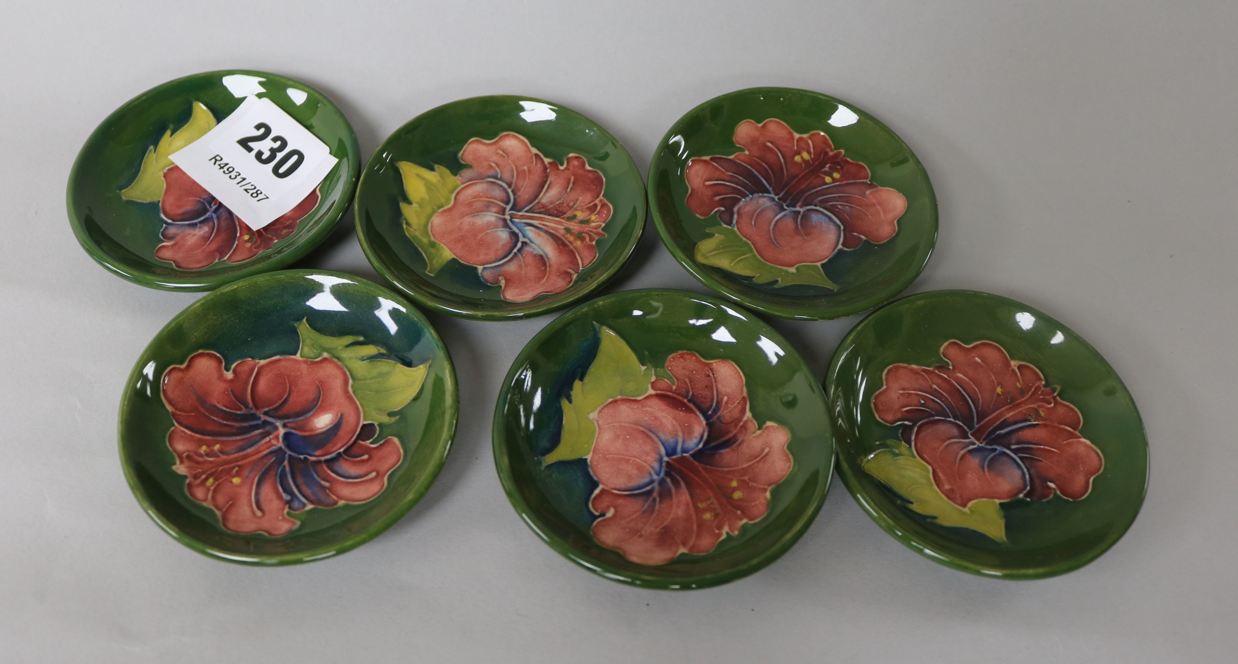 A set of six Moorcroft Hibiscus pattern trinket dishes 8cm