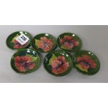 A set of six Moorcroft Hibiscus pattern trinket dishes 8cm