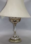 A 19th century painted and gilt white overlaid glass lustre, mounted as a table lamp, with spear