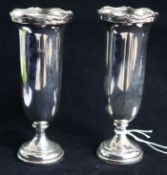 A pair of George V silver spill vases by Reid & Sons, London, 1923, weighted, 14.5cm.