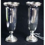 A pair of George V silver spill vases by Reid & Sons, London, 1923, weighted, 14.5cm.