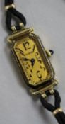 A lady's 18ct gold Longines manual wind wrist watch retailed by Tiffany & Co, on fabric strap.