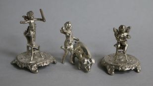 Three late 109th/early 20th century continental silver miniature cherub groups, two with chairs