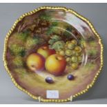 A Royal Worcester cabinet plate painted with fruit by Freeman 27cm