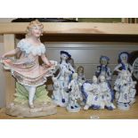 Ten assorted Continental bisque and porcelain figurines largest 36cm