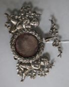 A late 19th/early 20th century American sterling silver Cherub watch holder, by Bigelo, Kennard &