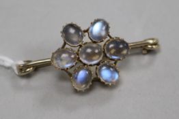 A yellow metal and moonstone cluster bar brooch, 41mm.