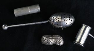 An Asprey silver box modelled as a peanut, an Edwardian silver vesta case, a silver lipstick
