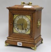 An Edwardian oak cased mantel clock height 29cm