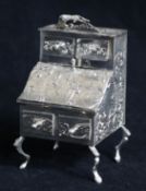 A late 19th century German Hanau? miniature silver model of a bureau cabinet, import marks for