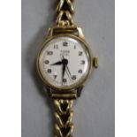 A lady's 1960's 9ct gold Tudor Royal manual wind wrist watch, on a 9ct gold bracelet.