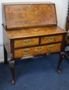 An oak, walnut and parquetry bureau, 18th century, having writing fall front over two short