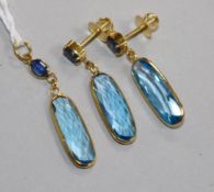 A 14ct gold, blue topaz and sapphire suite of jewellery comprising a pendant and pair of earrings,