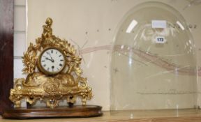 A late Victorian gilt metal mantel timepiece with glass dome timepiece 31cm