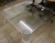 A perspex and glass coffee table W.120cm
